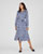 Jurk in warm tricot met knoopsluiting.
